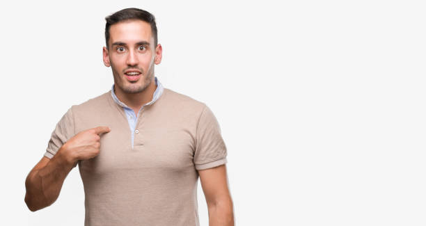istock Handsome young man with surprise face pointing finger to himself 1044257204
