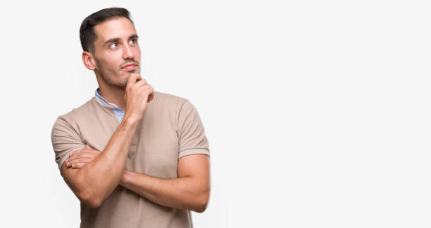 istock Handsome young man serious face thinking about question, very confused idea 1044257210
