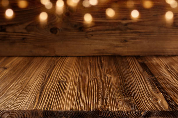 istock Wooden background with golden bokeh 1044258972