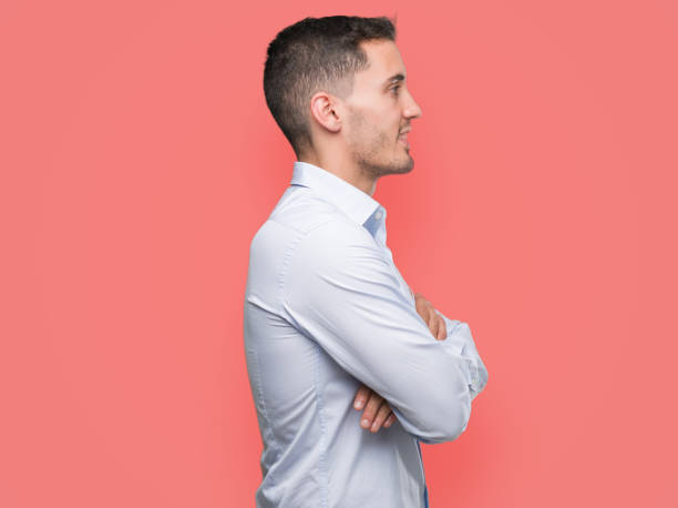 istock Handsome young businessman looking to side, relax profile pose with natural face with confident smile. 1044259540