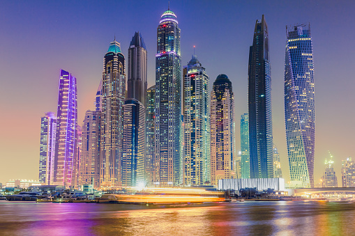 Dubai,UAE - October 5 2017: Amazing vibrant cityscape and skyline of Dubai. Development, skyline, skyscrapers in Dubai marina. high rise buildings, progress in UAE. Apartments and offices. Reflection