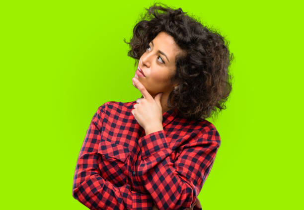 istock Beautiful arab woman thinking thoughtful with smart face 1044266508
