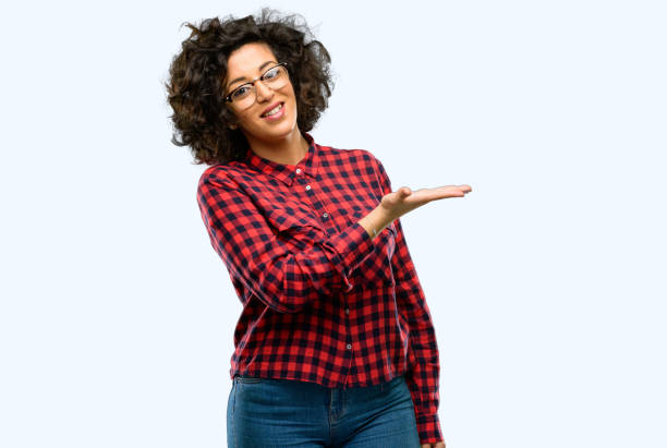 istock Beautiful arab woman holding something in empty hand 1044266564