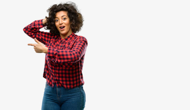 istock Beautiful arab woman pointing away side with finger 1044266642