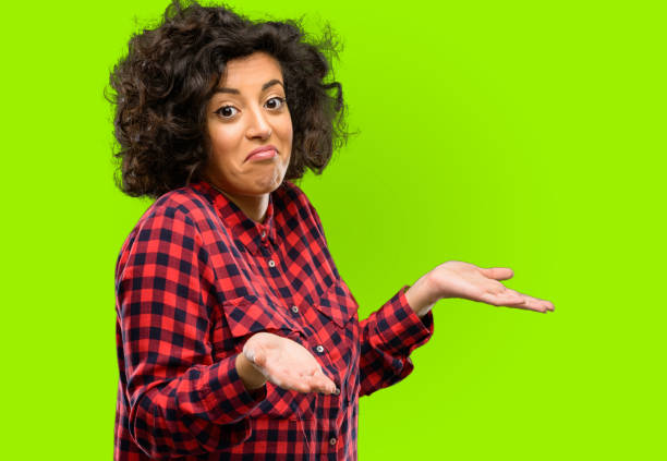 istock Beautiful arab woman doubt expression, confuse and wonder concept, uncertain future 1044266730