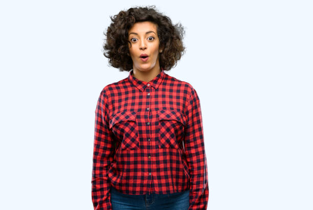 istock Beautiful arab woman happy and surprised cheering expressing wow gesture 1044267112