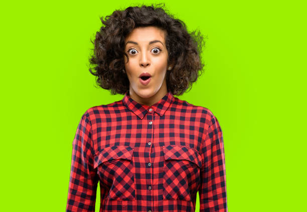 istock Beautiful arab woman happy and surprised cheering expressing wow gesture 1044267120