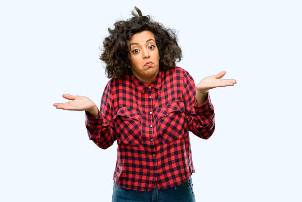 istock Beautiful arab woman doubt expression, confuse and wonder concept, uncertain future shrugging shoulders 1044267550