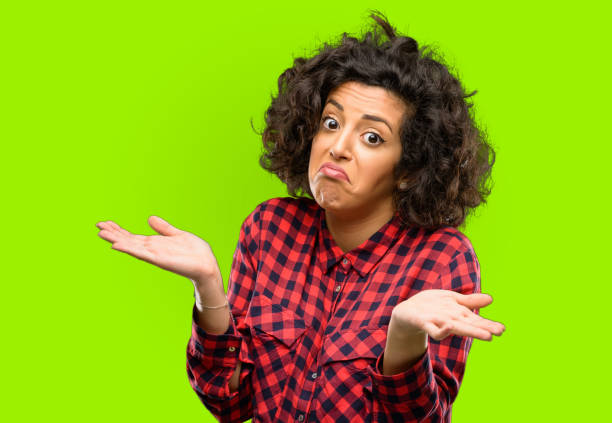 istock Beautiful arab woman doubt expression, confuse and wonder concept, uncertain future 1044267644
