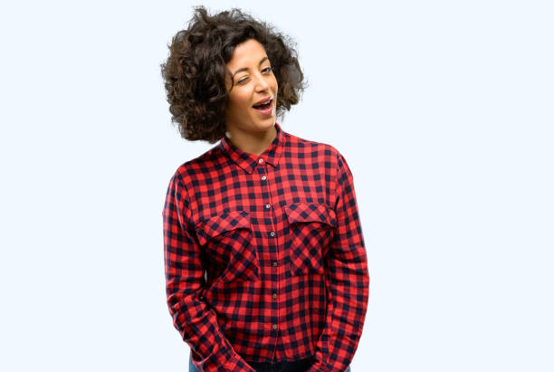 istock Beautiful arab woman blinking eyes with happy gesture 1044267690