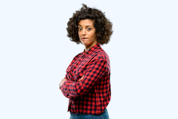 istock Beautiful arab woman nervous and scared biting lips looking camera with impatient expression, pensive 1044267732