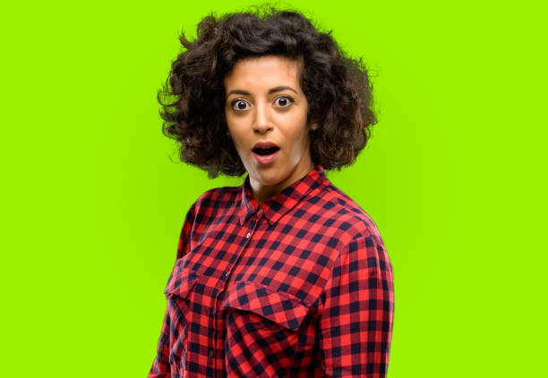 istock Beautiful arab woman scared and surprised cheering expressing wow gesture. Unbelieving 1044267878
