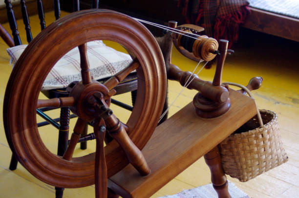 istock vintage wooden spinning wheel 1044268120