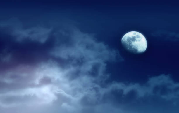 istock Background of night sky with mysterious clouds and moon 1044268146