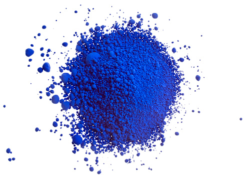 A pile of powdered blue artist pigment, isolated on white.