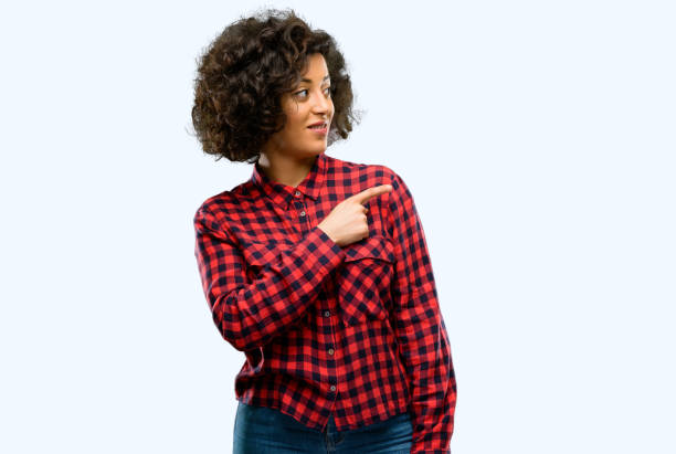 istock Beautiful arab woman pointing away side with finger 1044270564