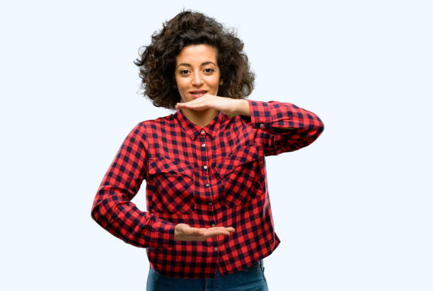 istock Beautiful arab woman holding something, size concept 1044270896