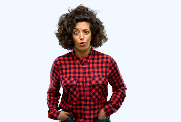istock Beautiful arab woman happy and surprised cheering expressing wow gesture 1044271276