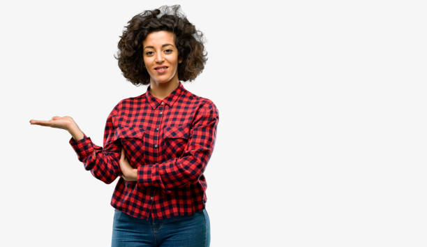 istock Beautiful arab woman holding something in empty hand 1044271742