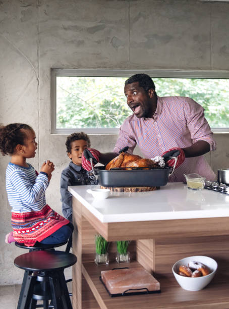 istock Fathers preparing thanksgiving turkey 1044276644