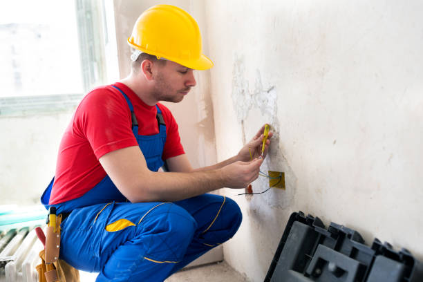 istock Finishing touches on a wall socket spot 1044280568