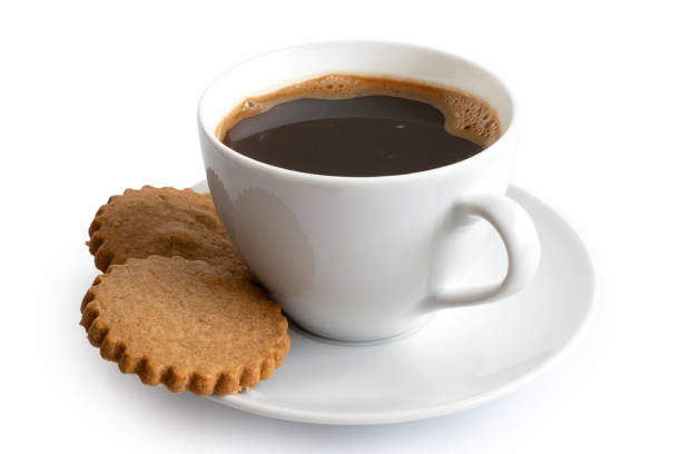 istock A cup of black coffee with two gingerbread biscuits isolated on white. White ceramic cup and saucer. 1044280644