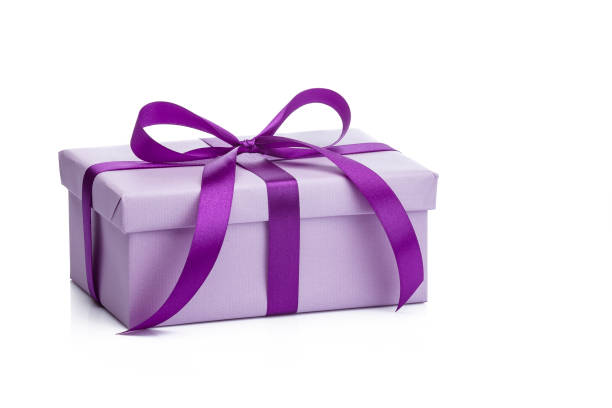 istock Purple gift box with purple ribbon isolated on white background 1044280998