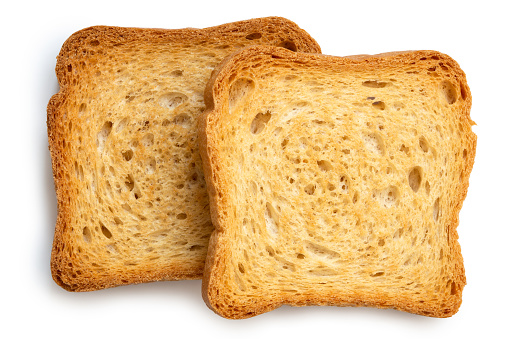 Two plain melba toasts isolated on white from above.