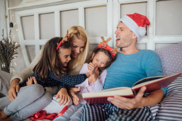 istock Parents having fun with children in bed 1044292106