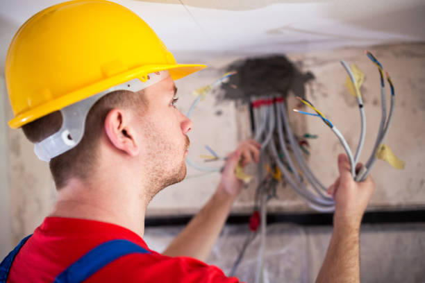 istock Electrician inspecting cables and wires 1044292466