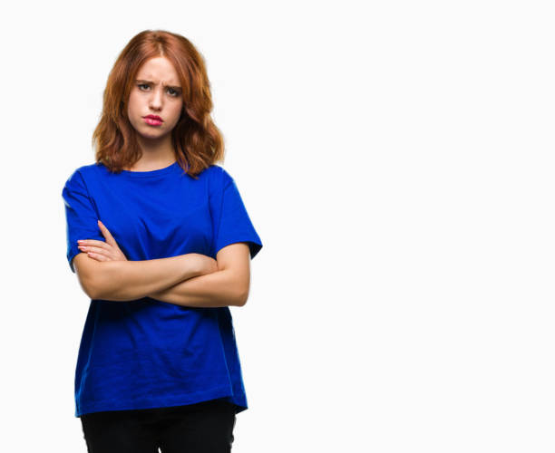 istock Young beautiful woman over isolated background skeptic and nervous, disapproving expression on face with crossed arms. Negative person. 1044292774