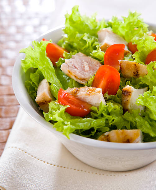 istock A bowl with chicken and caesar salad 104429694