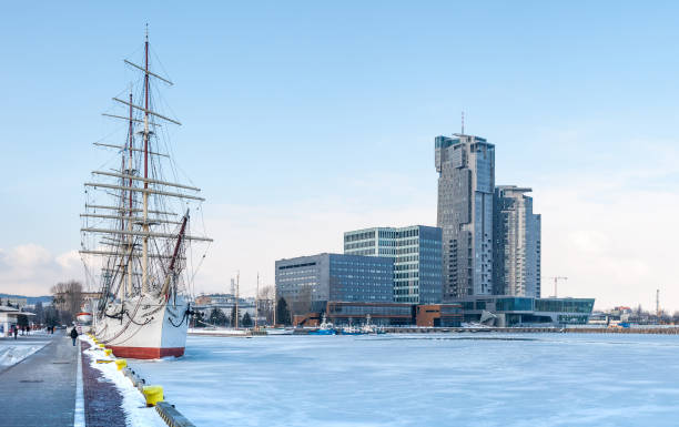 Old ship on frozen sea and busyness building