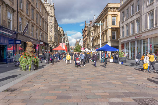 Buchanan Street In the City Centre of Glasgow Glasgow City, Scotland, UK - September 22, 2018: A very busy Buchanon Street in Glasgow city centre busy with visitors and shoppers to the area. high street shops stock pictures, royalty-free photos & images