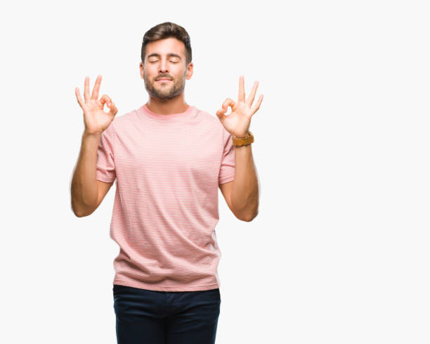 istock Young handsome man over isolated background relax and smiling with eyes closed doing meditation gesture with fingers. Yoga concept. 1044302114