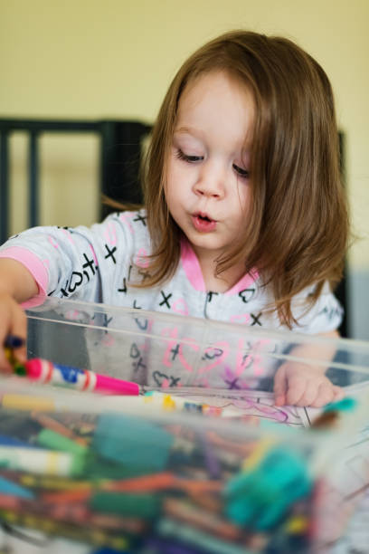 istock Girl Plays with Markers 1044302232