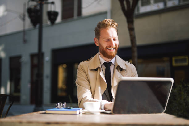 istock Beautiful bearded businessman working from a cafe 1044302246