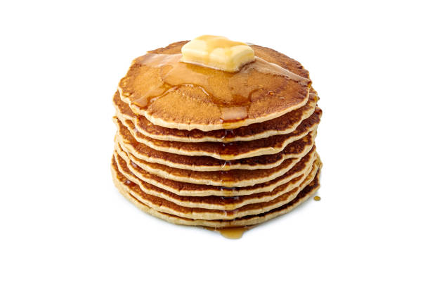 istock Stack of pancakes with butter and maple syrup on white 1044302282