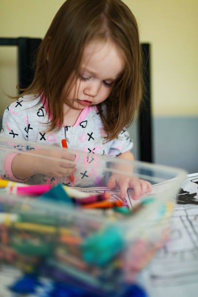 istock Girl Plays with Markers 1044302292