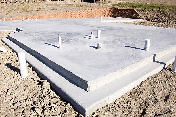 Picture of a concrete slab for a house.  Taken during the early morning.