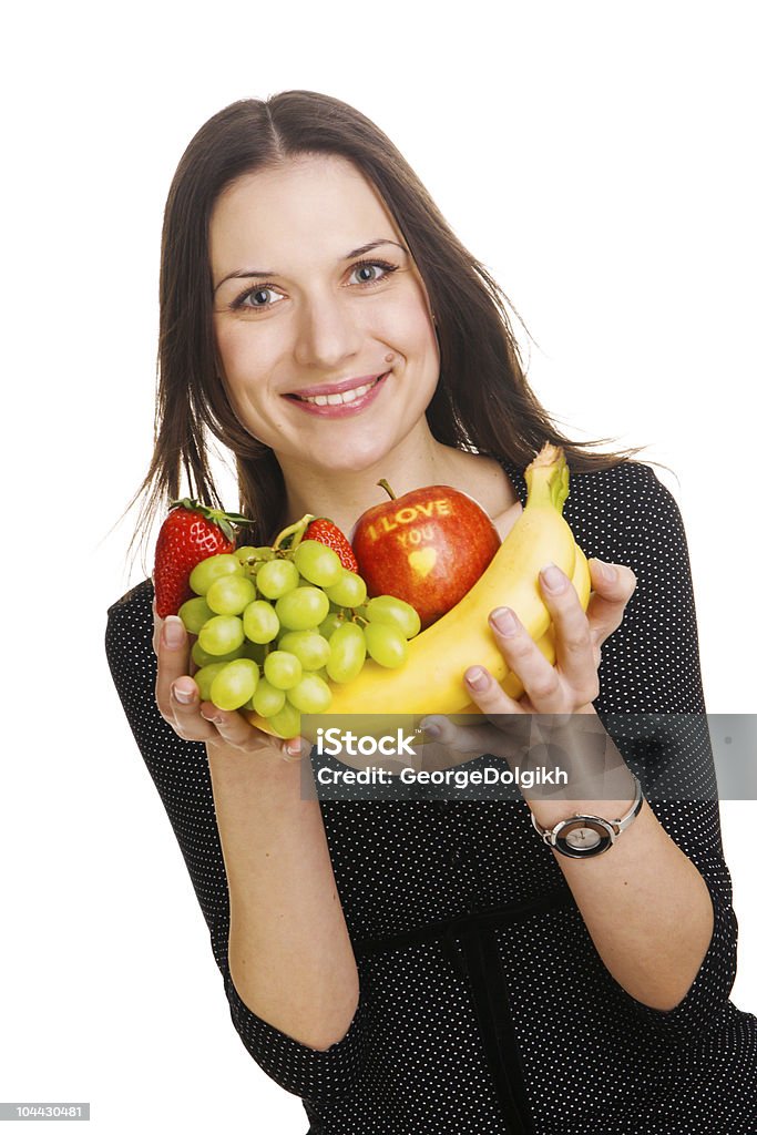 Bella mujer joven con un racimo de frutas - Foto de stock de Adulto libre de derechos