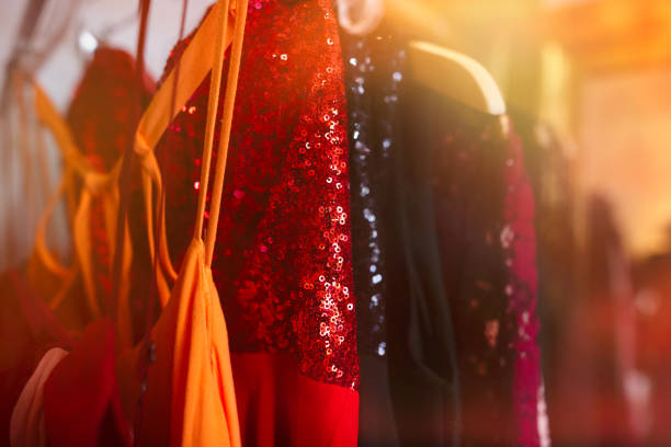 the red sequin dance dress Clothing on hanger at the trendy shop boutique garment store fashion rack stock pictures, royalty-free photos & images