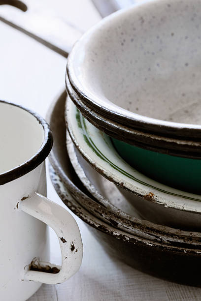 istock Assorted enameled plates pans  and a mug  very old 104431041