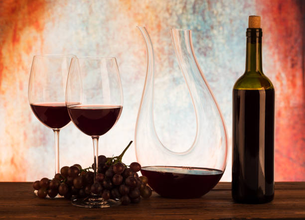 istock Glass decanter with red wine and grapes 1044312488