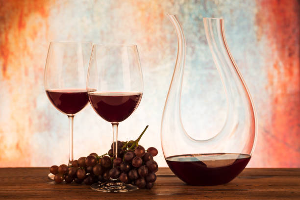 istock Glass decanter with red wine and grapes 1044314546
