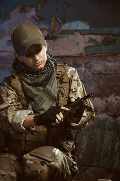 istock the people in uniform with weapons in the ruins 1044316180