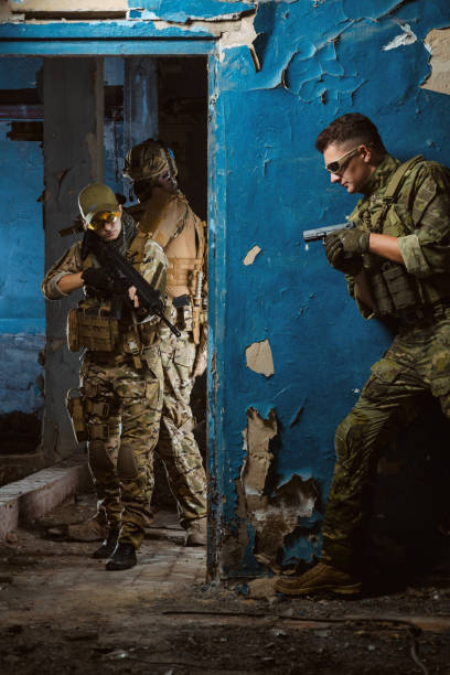 istock the people in uniform with weapons in the ruins 1044316182