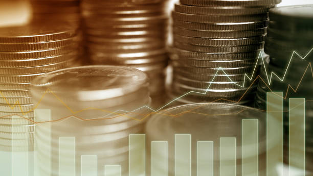 istock Double exposure of graph and rows of coins 1044318518