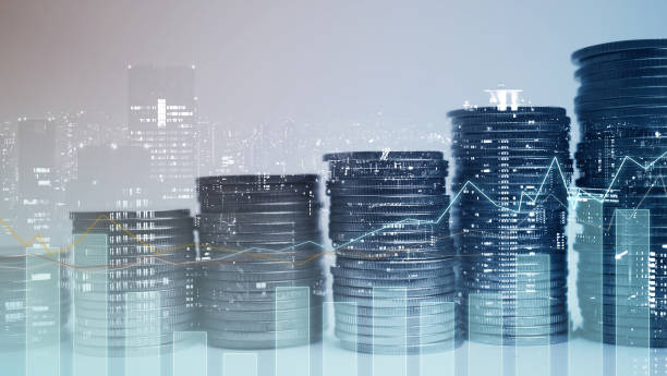 istock Double exposure of graph and rows of coins 1044318520