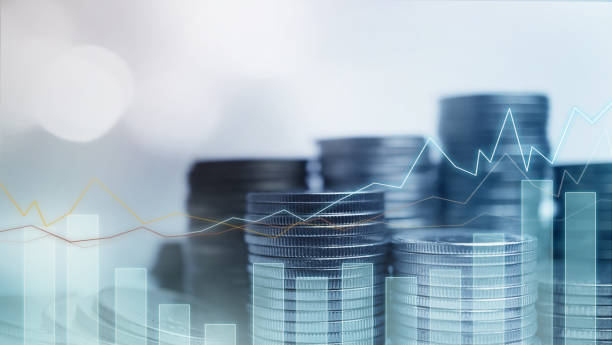 istock Double exposure of graph and rows of coins 1044318538